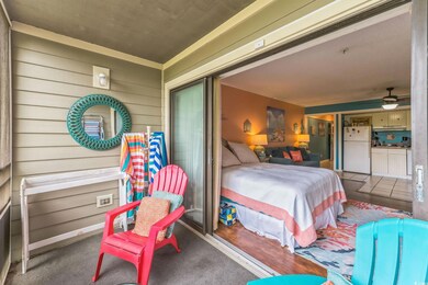 Bedroom featuring freestanding refrigerator