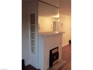 Brick front fireplace with gas, heater insert.  Mi