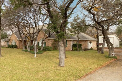 Two car garage with workshop, and RV barn in backg