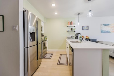 Kitchen featuring stainless steel appliances, a s