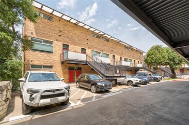 View of property with uncovered parking