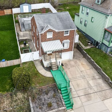 Aerial View. This aerial view shows the fenced yard and above ground pool.