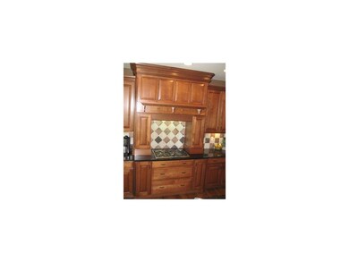 Kitchen. GAS TOP STOVE WITH TILE BACKSPLASH.
