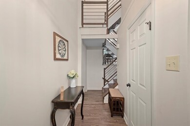 View from front door looking to staircase past hal