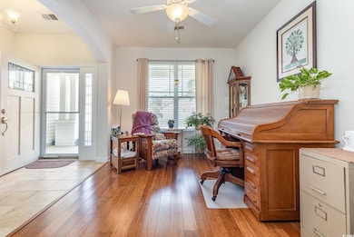 Office area featuring baseboards, visible vents, c