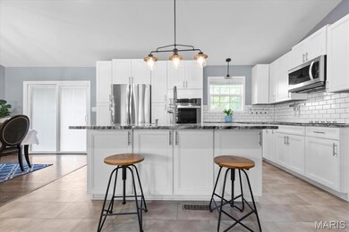 Remodeled kitchen includes S/S appliances, granite island with breakfast bar, and is easy entertaining!