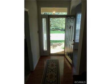 The foyer boasts hardwood floors.
