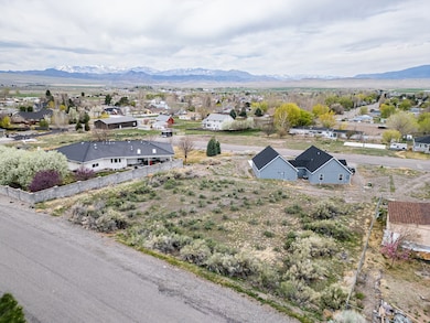 Aerial view of residential area featuring a mountainous background