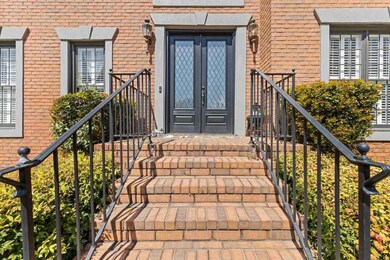 Elegant front doors are perfect complement to this