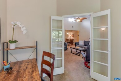 Classic french doors allow the den to be closed of