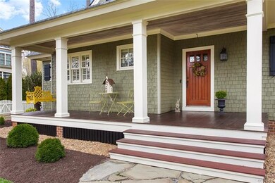 A Brazilian Redwood Front Porch welcomes you to th
