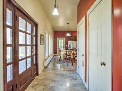 Front entrance features a mahogany...