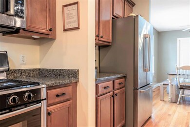 The kitchen extends even further, to the counter-depth stainless French door refrigerator.