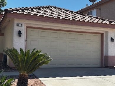Garage featuring concrete driveway