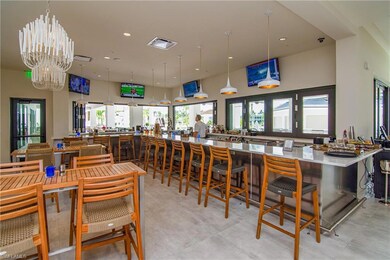 Open air bar overlooking resort style pool...