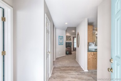 Front entry hall with newer, wood look tile.