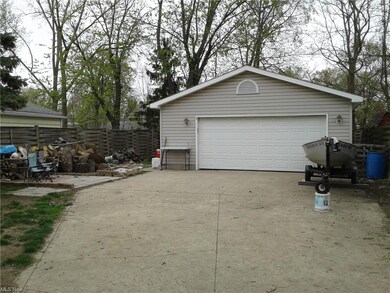 2 car garage with patio and firepit.