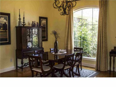 Formal dining room with wood floors
