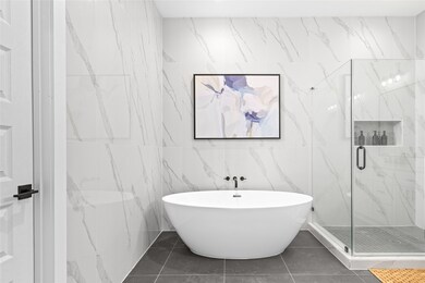 Spa-like primary bathroom with oversized walk-in s