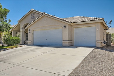Mediterranean / spanish-style home with a garage,