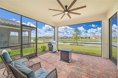 Sunroom / solarium featuring a water view and ceil