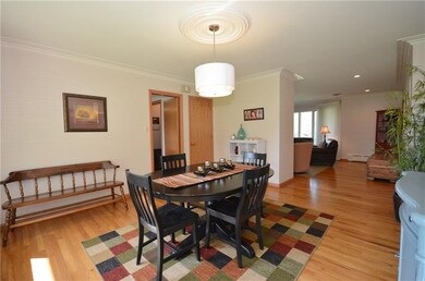 The dining room is open to the living room and kit