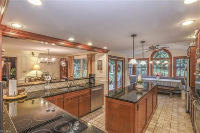 The kitchen has granite counters and stainless ste