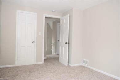 Bedroom with light carpet