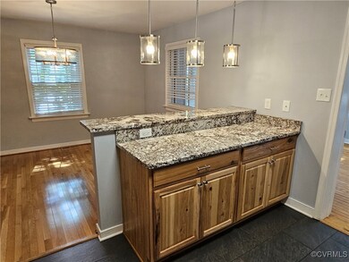 Kitchen with kitchen peninsula, pendant lighting,