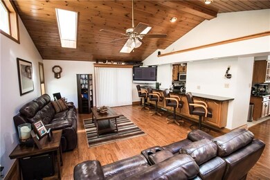 Check out the wood ceiling with skylights & lighte