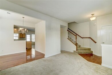 Alternate angle of living room, showing dining roo