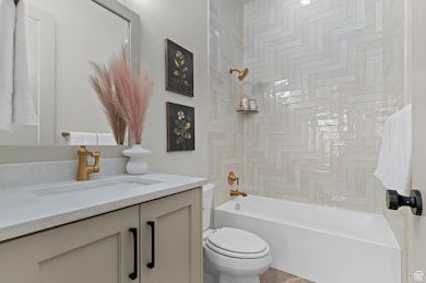 Full bathroom featuring vanity and shower / bath combination