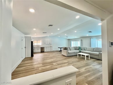 Living room with vaulted ceiling, plenty of natura