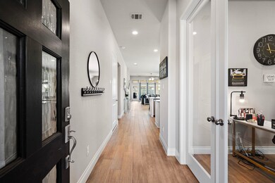 Inviting entryway featuring wood-look tile and a h