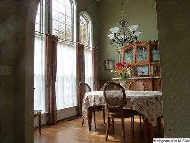 Light filled dining room with arched entrance