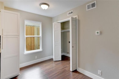 Unfurnished bedroom featuring baseboards, visible