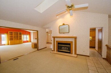 Cathedral ceiling with gas fireplace, open to the 