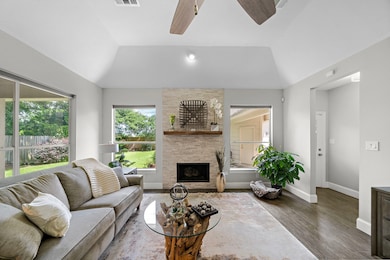 This living room features a high ceiling, modern c