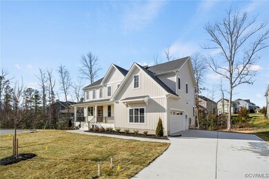 View of front of house with a garage and a front y