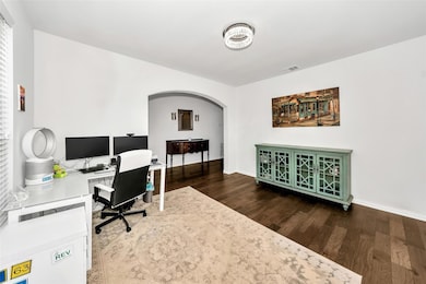 Hardwood flooring extends into the formal dining/o
