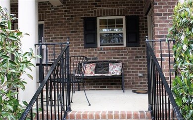 Nice covered entry porch with enough space for som