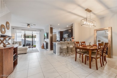 Dining room with a ceiling fan, recessed lighting,