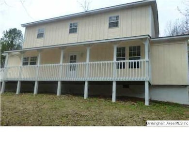Long, welcoming porches on front, side and back of