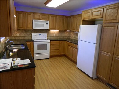 Granite counter tops with ceramic backsplash. Kitc