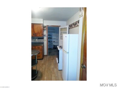 Kitchen view of laundry room