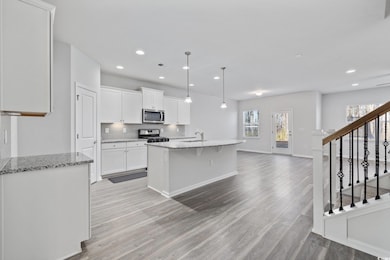 Kitchen with a center island with sink, appliances