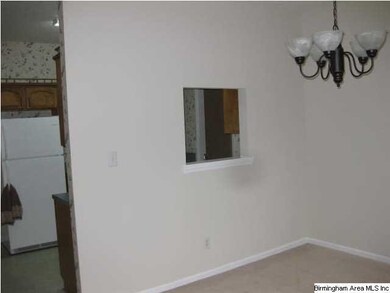 A view of the dining room showing the pass through