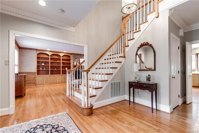 Open foyer with dentil moulding features turned st