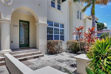 Large covered entry with big windows overlooking t