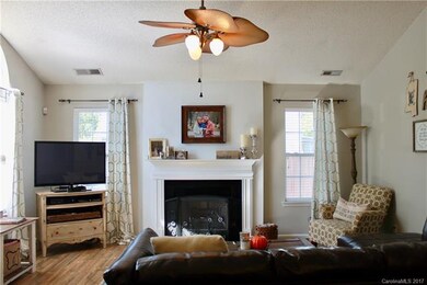High ceilings, wood floors and beautiful fireplace